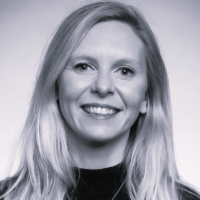A headshot of Sophie Frost in black and white