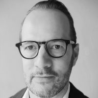 A headshot of Pieter Verdegem in black and white.