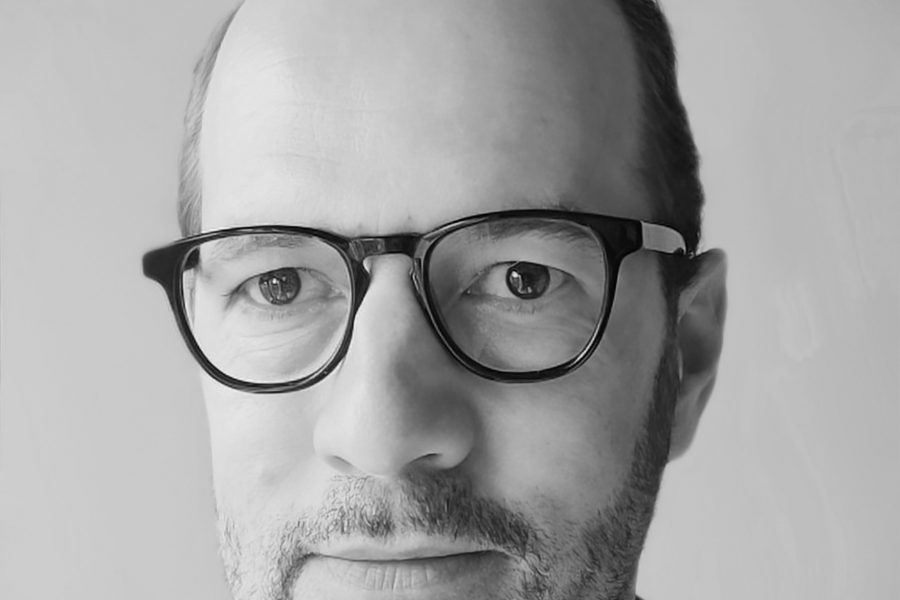 A headshot of Pieter Verdegem in black and white.